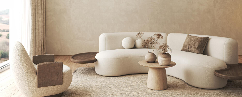 A cozy living room featuring a comfortable couch, a stylish chair, and a modern table, creating a welcoming atmosphere.
